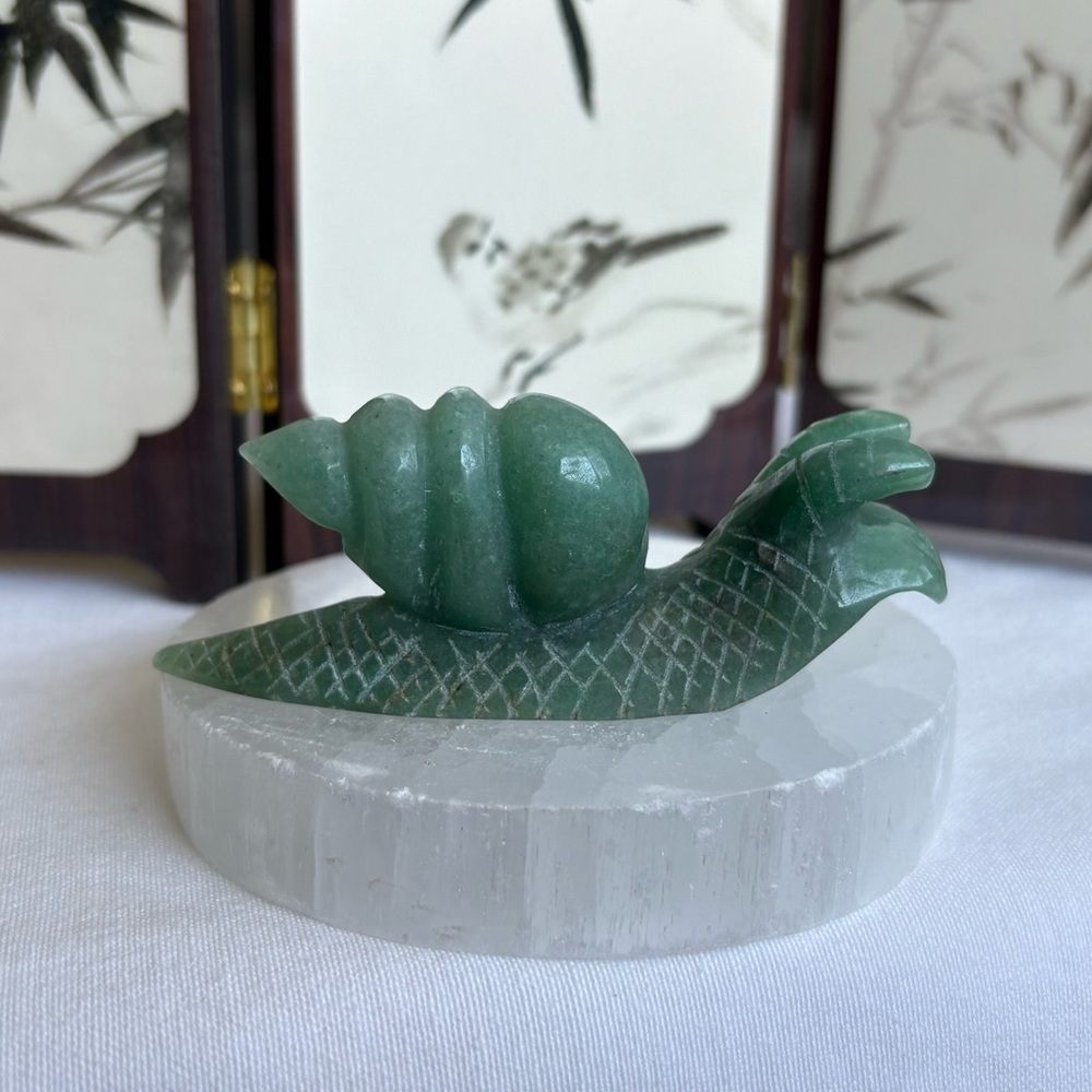 Green aventurine crystal snail carving